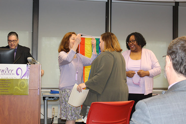 IUP student receives a cord at the 2019 Lavender Graduation