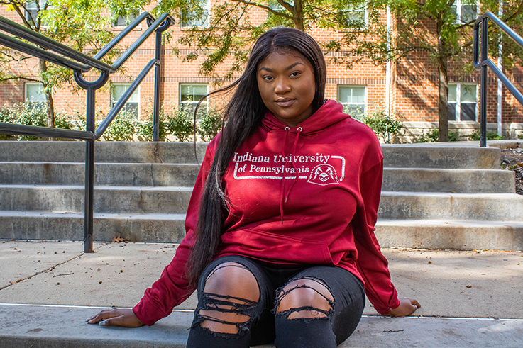 Student in IUP hoodie