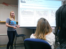 Tutor and students at a writing workshop