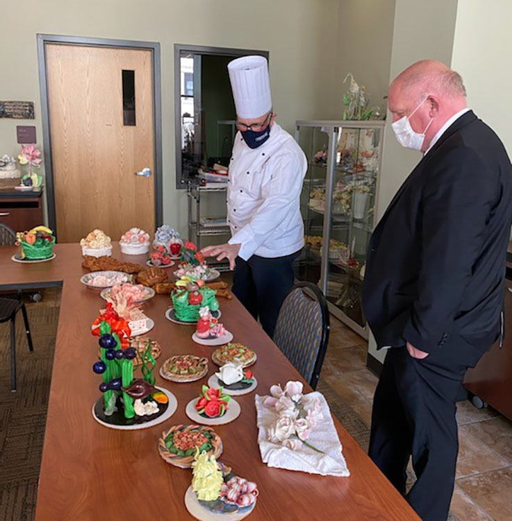 Congressman Thompson visits the Fairman Centre where Chef Kapusta showed him the sugar work done by students and faculty.