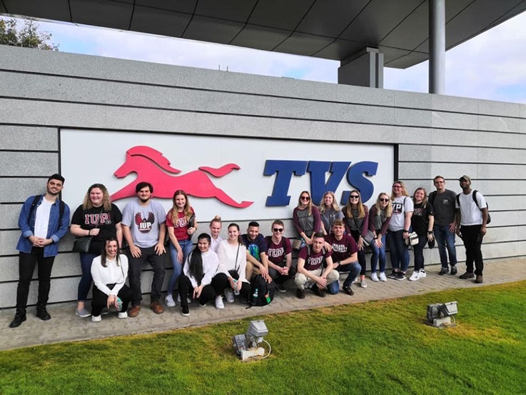 Students take time to stop for photos outside Infosys and TVS during while doing company visits.