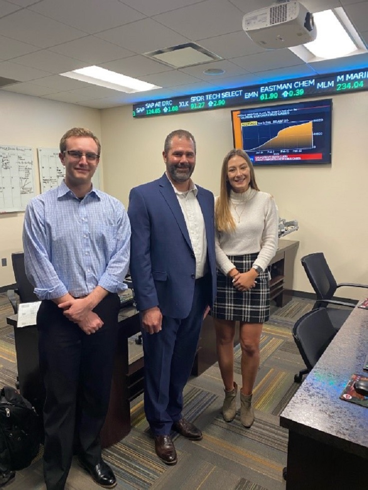Pictured with Rising '96 are Seth Thomas, a junior Accounting and Finance student and Rebecca Shellenbarger, a senior Finance student.