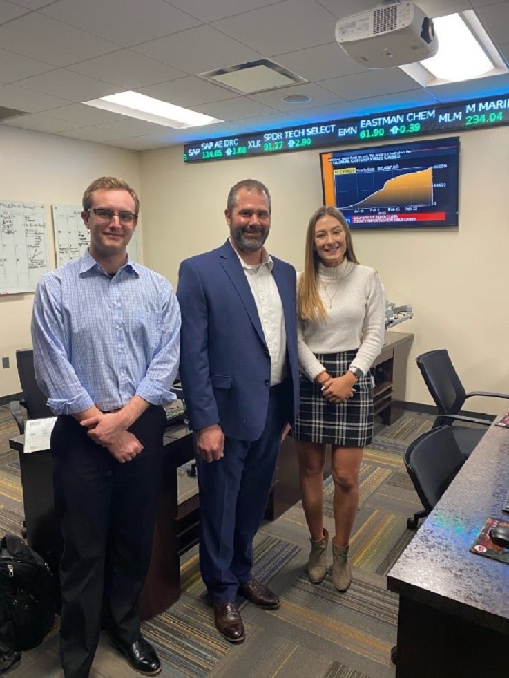 Pictured with Rising '96 are Seth Thomas, a junior Accounting and Finance student and Rebecca Shellenbarger, a senior Finance student. Pictured with Rising '96 are Seth Thomas, a junior Accounting and Finance student and Rebecca Shellenbarger, a senior Finance student.