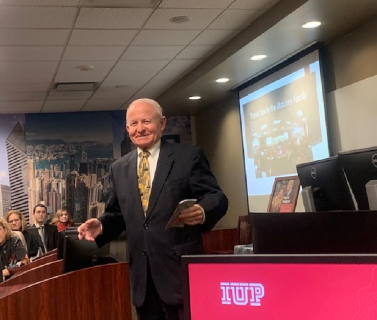 Ed Mackey speaks at the dedication of the Mackey Family Charitable Trust Financial Trading Room