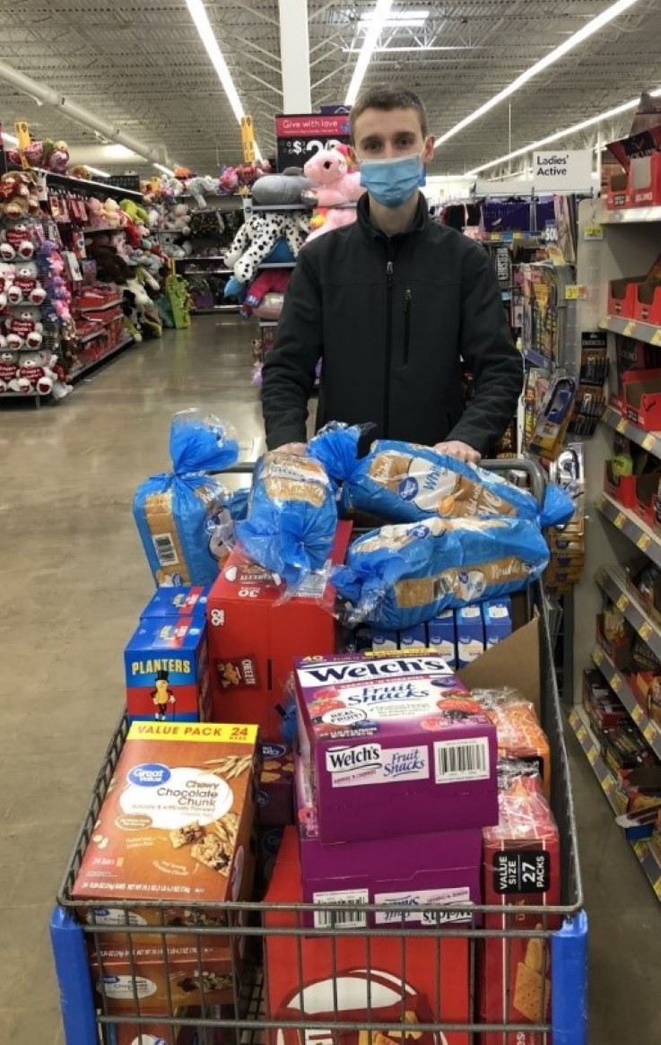 SAA Community Service Chair Logan Stear purchasing items in Walmart