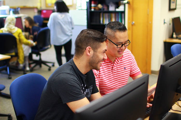 Student being tutored at the Writing Center