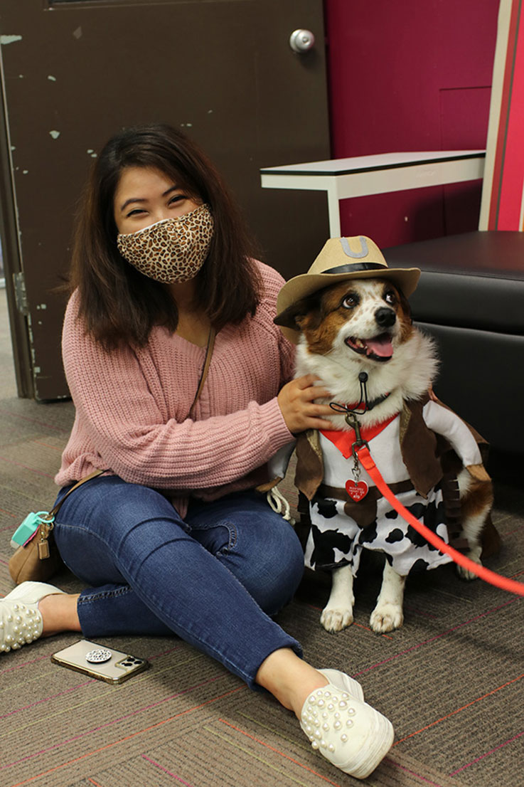 Female student with a therapy dog