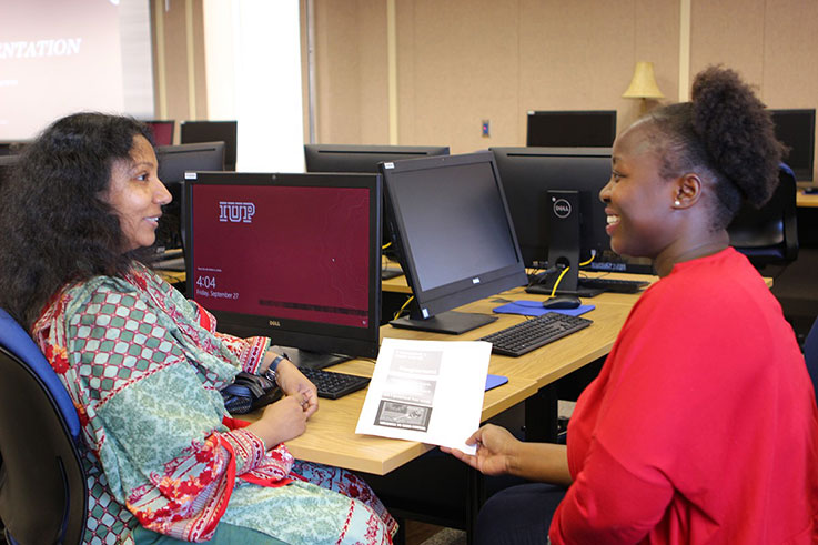 Two women talking and smiling