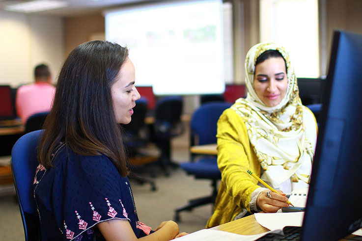 Two female students interacting