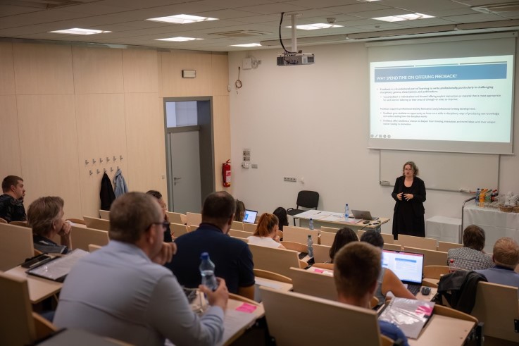 Professor Dana Driscoll leads a workshop for a group of faculty in the Czech Republic